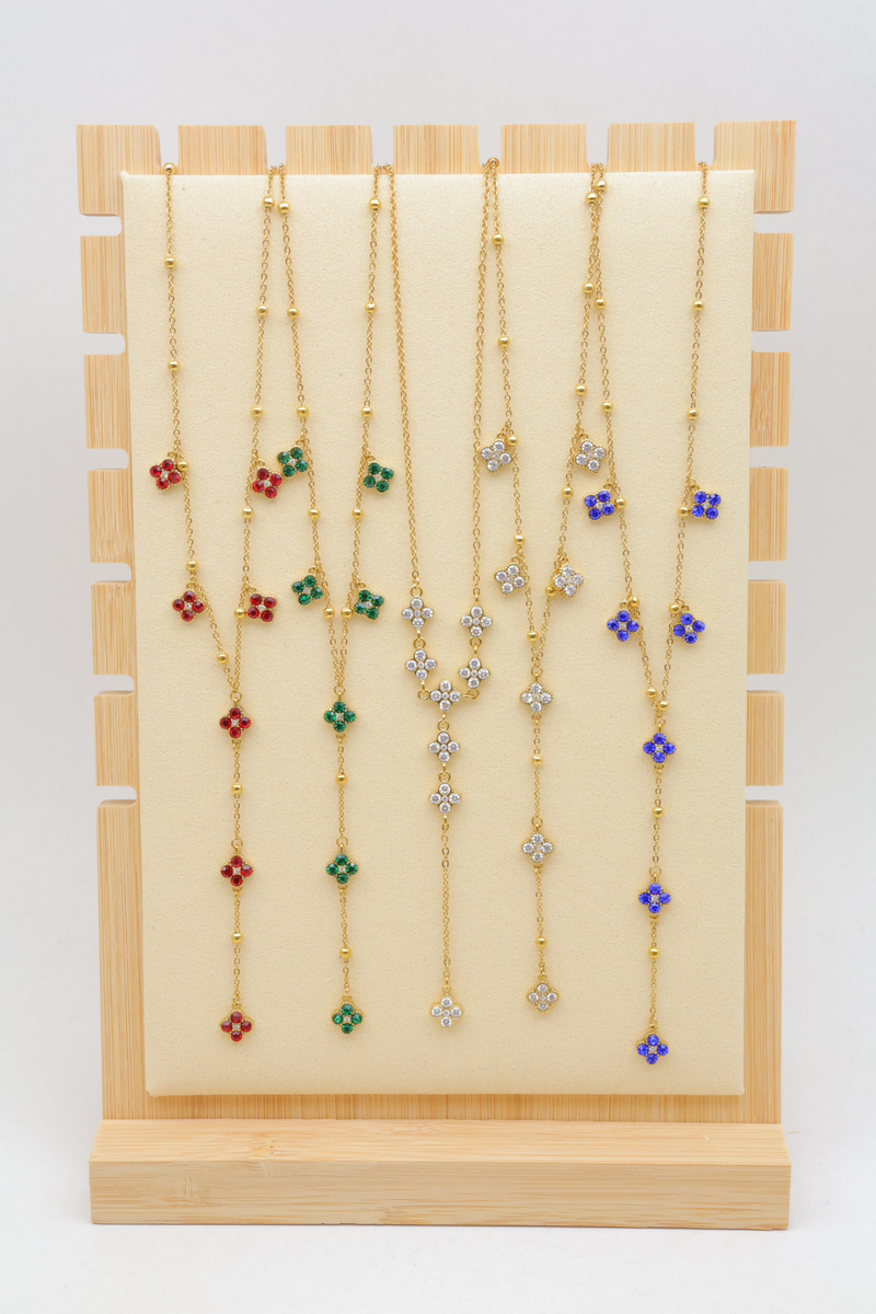 Set of 12 assorted gold-plated stainless steel necklaces, displayed on a velvet stand — Multicolor