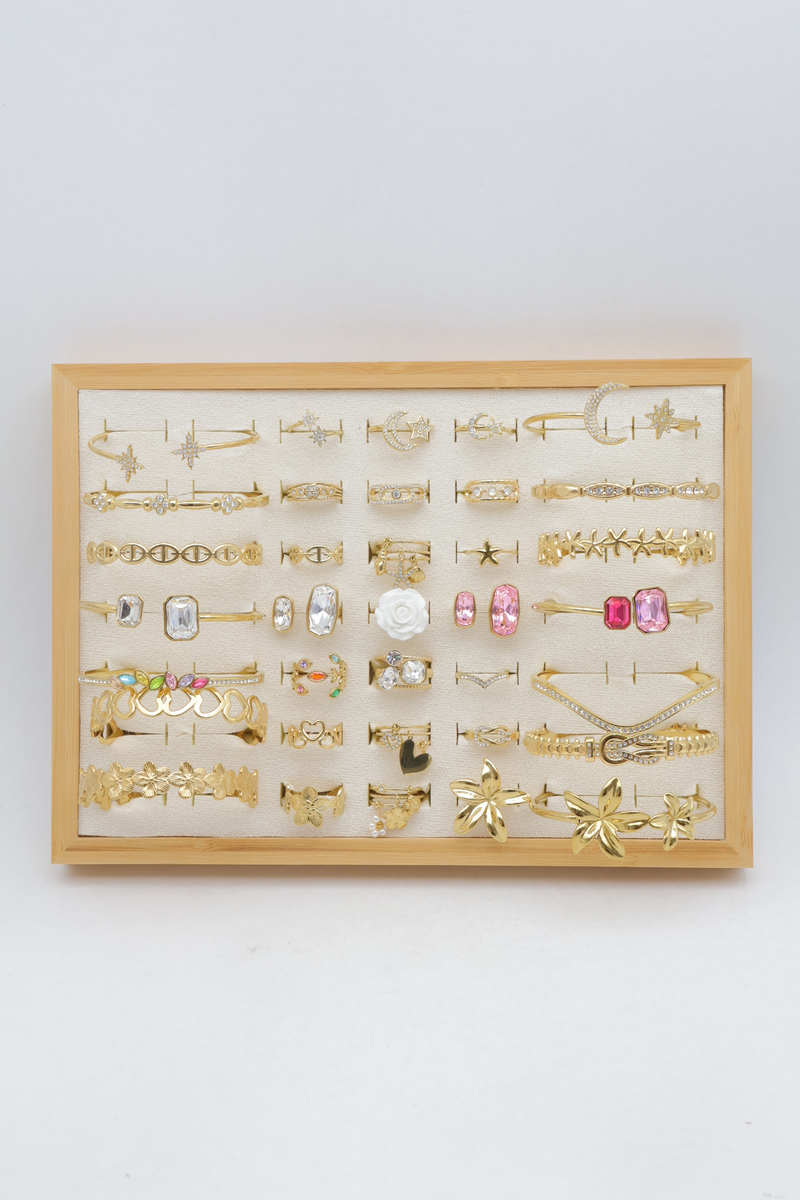 Assortiment de 21 bagues et 14 joncs étoile, cœur et fleur